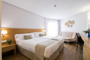 เตียงในห้องที่ Cullera Holiday +92 ภาพ