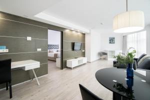 Uma TV ou centro de entretenimento em Cullera Holiday