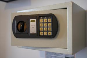 a remote control is attached to a wall at Hotel Rojas Inn in Cusco