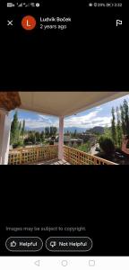 a screenshot of a website with a picture of a balcony at Gangs-Shun Homestay in Leh
