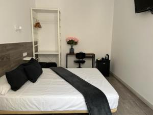 Cama o camas de una habitación en Hostal Rías Bajas
