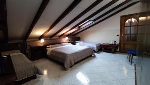 Postel nebo postele na pokoji v ubytování Hotel Emiliana