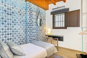 Ένα ή περισσότερα κρεβάτια σε δωμάτιο στο Can Bona Casa Dúplex con terraza
