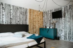 Televízia a/alebo spoločenská miestnosť v ubytovaní Joy Aparthotel Keilberg
