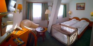Posteľ alebo postele v izbe v ubytovaní Hotel Spindlerova Bouda