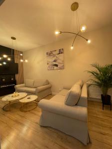 Posezení v ubytování Sunset Resort APARTAMENT DZIESIĄTKA przy plaży