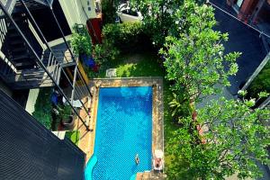 an overhead view of a swimming pool in a building at Chiang Mai Thai House,Thapae in Chiang Mai