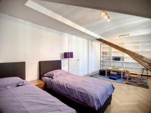 Ein Bett oder Betten in einem Zimmer der Unterkunft Magnifique Riad avec patio extérieur