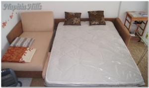 a large bed in a room with a couch at Apartment Napitia Hills in Pizzo +18 photos