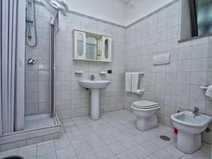 a bathroom with a sink and a toilet and a shower at Hotel Silverado in Aversa