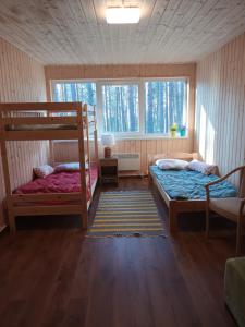 Postel nebo postele na pokoji v ubytování Männi puhkebaas
