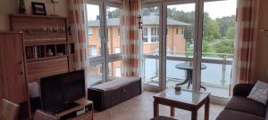 Posezení v ubytování moderne 3-Raum Ferienwohnung Strandmöwe mit Panoramafenster