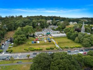 an aerial view of a large house with a park at The Haven Hotel in Dunmore East