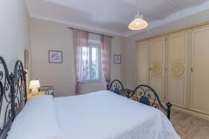 Postel nebo postele na pokoji v ubytování Casa Fiorenza