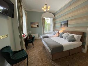 Posteľ alebo postele v izbe v ubytovaní The Haven Hotel