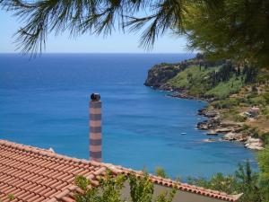 a view of the ocean from the roof of a house at Giota & Antonia Apartments in Koroni