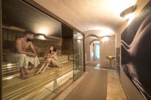 Televízia a/alebo spoločenská miestnosť v ubytovaní Hotel Palazzo San Lorenzo & Spa