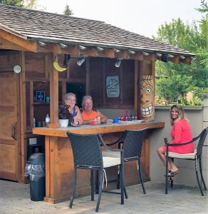 a group of people sitting at a bar at Blue Mountains Bed and Breakfast in Blue Mountains