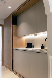 A kitchen or kitchenette at Ariadne Suites