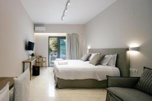 A bed or beds in a room at Ariadne Suites