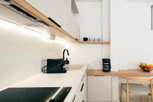 A kitchen or kitchenette at Ariadne Suites