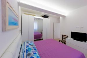 Postel nebo postele na pokoji v ubytování Casa di Nada - Goelba