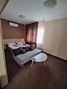 En eller flere senger på et rom på Brasna apartment 2-Kupalisko