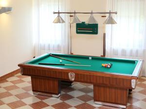 a pool table sitting in a room with afits at Veronello Resort in Bardolino