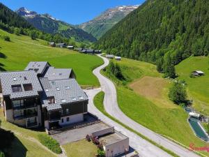 an aerial view of a house on a hill with a road at Appartement Arêches-Beaufort, 3 pièces, 6 personnes - FR-1-342-152 in Arêches-Beaufort