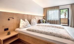 Postel nebo postele na pokoji v ubytování Pension Appartment Hecherhof