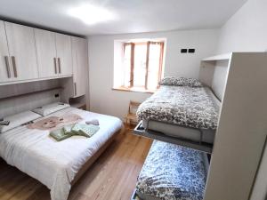 Cama o camas de una habitación en La Casetta in Montagna