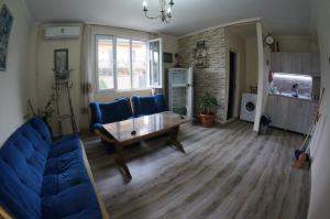 a living room with a couch and a table at Dream Land Batumi in Batumi