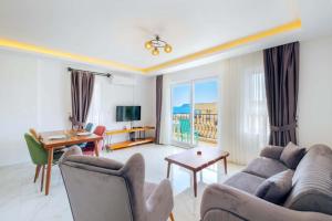 a living room with a couch and a table at Nergis Apart in Kaş
