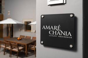 a sign on the wall of a dining room at Amaré Chania Luxury Residence in Stérnai