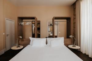 Cama ou camas em um quarto em Casa das Muralhas