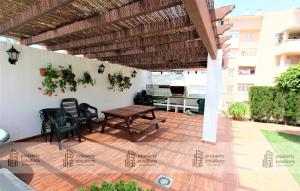 Un balcón o terraza de Pueblo del parque 12 - Terraza - Piscina y Playa- Urbanización tranquila- Perfecto para descansar
