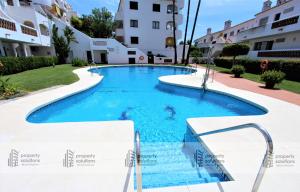 Piscina en o cerca de Pueblo del parque 12 - Terraza - Piscina y Playa- Urbanización tranquila- Perfecto para descansar