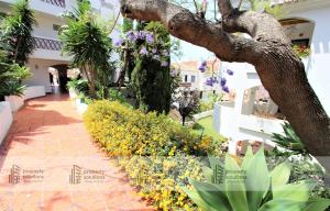 Jardín al aire libre en Pueblo del parque 12 - Terraza - Piscina y Playa- Urbanización tranquila- Perfecto para descansar