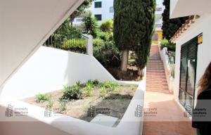 Jardín al aire libre en Pueblo del parque 12 - Terraza - Piscina y Playa- Urbanización tranquila- Perfecto para descansar