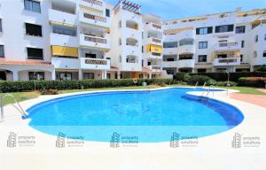 Piscina en o cerca de Pueblo del parque 12 - Terraza - Piscina y Playa- Urbanización tranquila- Perfecto para descansar