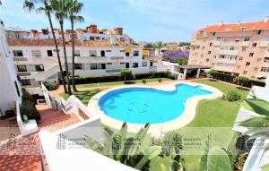 Piscina en o cerca de Pueblo del parque 12 - Terraza - Piscina y Playa- Urbanización tranquila- Perfecto para descansar