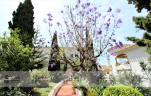 Jardín al aire libre en Pueblo del parque 12 - Terraza - Piscina y Playa- Urbanización tranquila- Perfecto para descansar