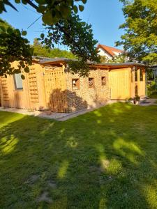 a house with a fence in a yard at Ferienhaus Helmig in Kurort Gohrisch