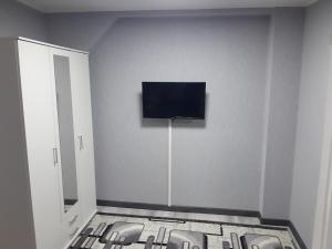 a room with a flat screen tv on the wall at 1 Zimmer Wohnung für 1-2 Gäste in Gößnitz