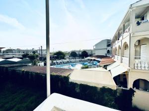 a view of a swimming pool from a building at Kappa & Lamda Apartments in Roda