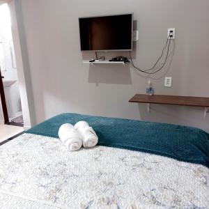 Кровать или кровати в номере Flat Temporada