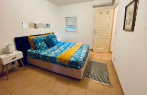 Postel nebo postele na pokoji v ubytování Appartement vue mer, piscine, dans quartier prisé de Gosier + 13 fotografií