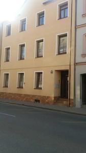 a large building on the side of a street at 1 Zimmer Wohnung für 1-2 Gäste in Gößnitz