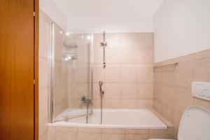 a bathroom with a shower and a bath tub at Casa Marina in Mergozzo +26 photos