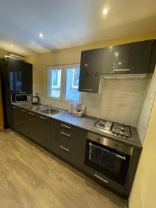 a kitchen with a sink and a stove top oven at Right choice room in Antwerp